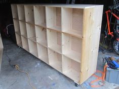 an unfinished bookcase is being built in a garage