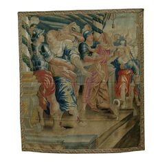 an old tapestry hanging on the wall with some people in it and one person holding something up