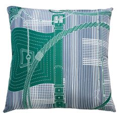 a blue and green pillow with white lines on it