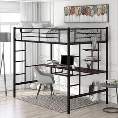 a loft bed with desk underneath it in a white room next to a chair and table