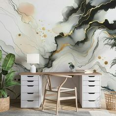 a desk and chair in front of a wall with an abstract painting on the wall