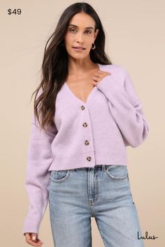 The Lulus Cozy Ease Lilac Button-Up Cropped Cardigan Sweater is the best way to ensure that getting dressed for a fall day is never complicated! This too-cute cardigan is composed of medium-gauge knit that shapes a V-neckline and long sleeves with exaggerated, drop shoulder seams. The boxy bodice boasts a functional button placket along the center before finishing at a trendy cropped hem. Ribbed knit accents the neckline, cuffs, and hem. Fit: This garment fits true to size. Length: Size medium m Purple Cardigan Outfits, Cropped Sweater Outfit, Lilac Sweater, Lavender Cardigan, Lilac Cardigan, Purple Cardigan, Cropped Cardigan Sweater, Cute Cardigans, Getting Dressed