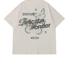 a white t - shirt with the words delicate wonder written on it and butterflies flying around