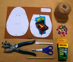 the supplies needed to make this craft include scissors, yarn, buttons, and paper