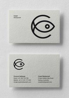 two business cards with black and white designs on them, one has an eye in the middle