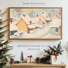 a painting hanging on the wall next to a christmas tree and other decorations in front of it