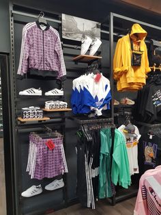 a clothing store display with various items on shelves