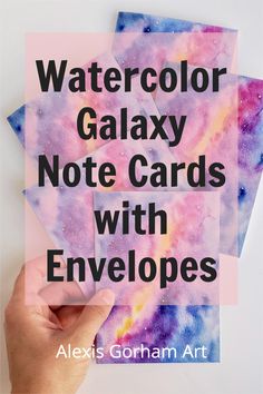 three watercolor galaxy note cards with envelopes in the middle and text overlay that reads, watercolor galaxy note cards with envelopes