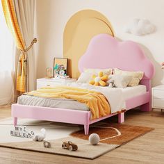 a child's bedroom with pink and yellow furniture