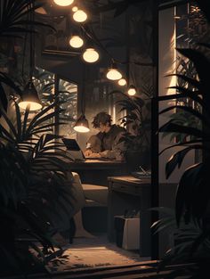 a person sitting at a table with a laptop in front of them, surrounded by plants