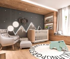 a baby's room with mountains painted on the wall and an elephant rug in the middle