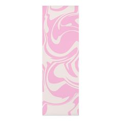 a pink and white bookmark with swirls on it's front cover, against a white background