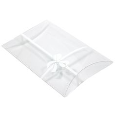 a white napkin with a bow on the front and back of it's wrapper