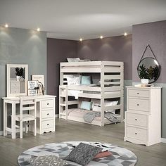 a bedroom with bunk beds, dressers and mirror on the wall next to each other