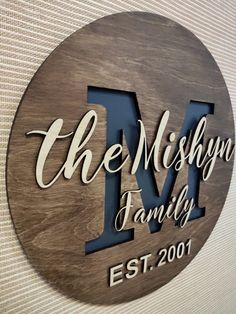 a wooden sign that says the mshyn family on it's front wall