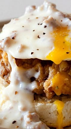 a close up of a plate of food with meat and cheese