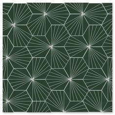 a green and white wallpaper with an abstract design in the shape of stars on it