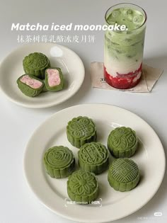 green mooncakes on plates next to a drink