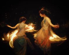 two women are dancing with fire in their hands