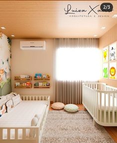 a baby's room with a white crib and wallpaper on the walls