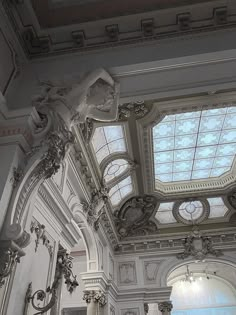 an ornate ceiling and windows in a building