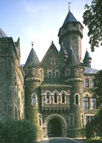 an old castle with two towers and a gate