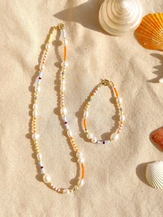 Summer Pearl Chain Jewelry, Gold Pearl Beaded Necklaces For Summer, Summer Gold Pearl Beaded Necklaces, Gold Pearl Beaded Necklace For Summer, Bohemian Pearl Necklace With Tiny Beads For Summer, Summer Pearl Chain Jewelry With Round Beads, Summer Pearl Charm Jewelry With Round Beads, Dainty Summer Beaded Necklace, Summer Pearl Beaded Bracelets As Gift