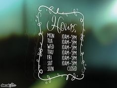 there is a glass sign that says hours on it and the words are written in white