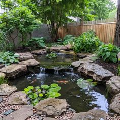 a small pond surrounded by rocks and water lilies