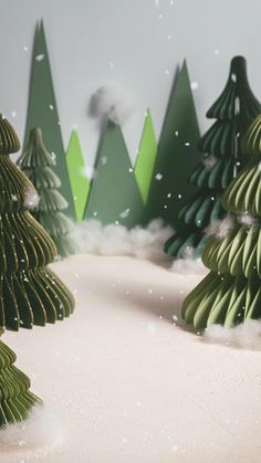 paper cut christmas trees in the snow