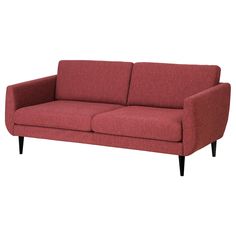 a red couch sitting on top of a white floor