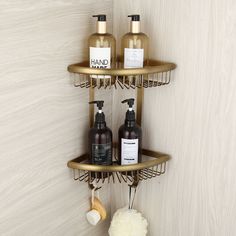 two shelves with soap, lotion and hand sanitizers on them in a bathroom