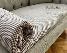 a couch that has some pillows on it