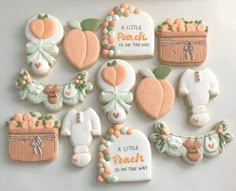 decorated cookies are arranged on a white surface