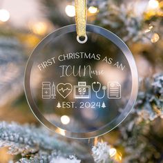 a glass ornament hanging from a christmas tree