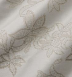 an image of a white fabric with floral design on the front and back side of it