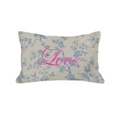 a blue and white floral pillow with the word love on it's front side