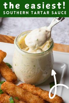 a white plate topped with fish sticks and dip