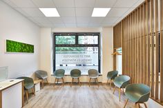 an empty room with chairs and desks in front of a large window that reads, meet biomatix digitales pontcent