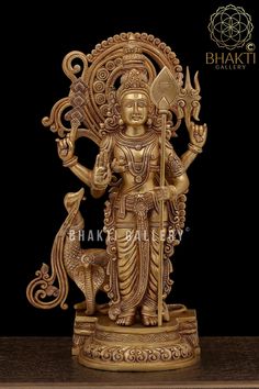 an intricately carved statue of the hindu god with a deer in his hand, on a