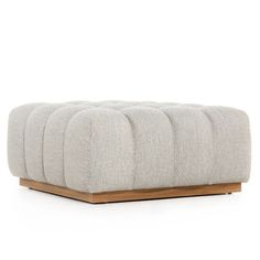 the footstool is made out of wood and has four rows of fabric on it