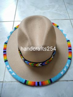 This listing is for beaded edge and brim fedora hat. The beads go around the whole edge and brim. Most hat brims are one size fits all.I have made a beautiful pattern that goes all round. Instead of having a plain fedora hat, this one is more beautiful with beads. Band height is 1 inch Circumference 57cm PURCHASE MULTIPLE HATS, PAY THE SAME AMOUNT OF SHIPPING FEE Beaded Wide Brim Fedora For Festivals, Wide Brim Beaded Fedora For Festival, Festival Beaded Fedora With Flat Brim, Artisan Beaded Fedora Hat, Beaded Hat Brim Patterns, Beaded Hats Native American, Beaded Hat Brim, Beaded Hat Band Patterns, Beaded Caps