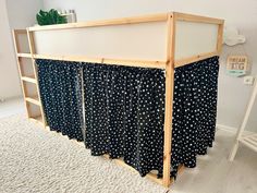 a bed frame with black and white stars on it