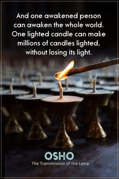 a candle that is lit with the words, and one awaked person can awake the whole world