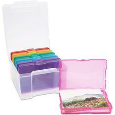 a plastic storage box filled with lots of different colored cards and folders on top of each other