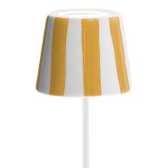 a yellow and white striped lamp shade