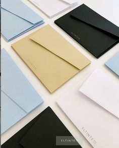 many different types of envelopes are laid out together