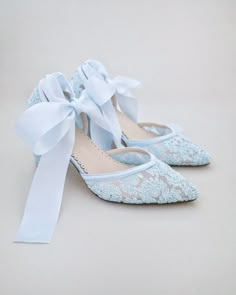 "Crochet Lace Wedding Shoes Collection. Classic and refined almond toe crochet lace. Sheer floral lace shapes an almond toe upper and block heel. Style as a lace up traditional ballet slipper (ballerina) or delicately loop the ribbons around the ankle and tie into an oversized bow. Choose from silky satin ribbon or sheer ribbon ties. Perfect for weddings, bridesmaids, parties, or any special occasion. DETAILS: HEEL HEIGHT: 2.75 inches COLORS AVAILABLE: Ivory, White and Light Blue UPPER: Synthetic upper and lining MATERIALS: Manmade outsole STYLE NAME: ABBY  SIZE FIT: RUNS LARGE  Not sure of which size to purchase? Shoes measurements are as follow: (Please note measurements taken the length of inside of shoe from toe to heel) SIZE 5 - 9.25\" SIZE 6 - 9.75\" SIZE 7 - 10\" SIZE 8 - 10.25\" SI Fitted Lace-up Lace Wedding Shoes, Spring Wedding Lace Shoes, Lace High Heel Wedding Shoes With Laces, Lace Wedding Shoes With High Heels And Laces, Flat Heel Lace Wedding Shoes, Lace Flat Heel Wedding Shoes For Ceremony, Lace Closed-toe Heels For Bridal Shower, Spring Wedding Shoes In Lace, Fitted Lace Wedding Shoes For Spring