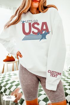 USA Tshirt, Lets Go USA Shirt, Summer Games Shirt, Comfort Colors Shirt, America Shirt, Comfort Colors Patriotic Shirts For Women, USA Shirt Custom text on sleeve.  Custom made just for you! 💜Premium Comfort Colors Lightweight Sweatshirt💜 This is the perfect lightweight crewneck 4th of July!  Trendy comfort colors sweatshirt with retro usa design. Cute shirt for her for cool summer nights around the bonfire. Gift for her for the summer games. Has vintage USA with stars in a retro design. Cute Relaxed Fit Crew Top With Custom Print, Gymnastics Sweatshirts, Go Usa, Usa Design, Usa Sweatshirt, Comfort Colors Sweatshirt, Summer Games, Usa Shirt, Comfort Colors Shirt