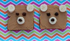 two pieces of bread with peanut butter and banana slices on them are shaped like bears